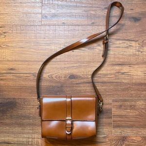 brown shoulder bag with gold hardware